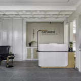 Minimalist White Fluted Reception Counter – Nordic Wood Base | SRK Modular Furniture Co.